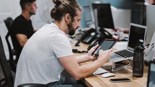 guy working with tablet at the office