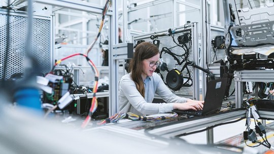 woman working on a project in a lab